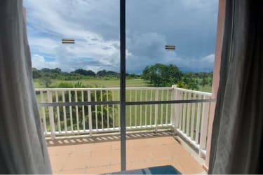 Spacious modern kitchen with granite countertops, dark cabinets and appliances in Decameron Golf Villas Panama