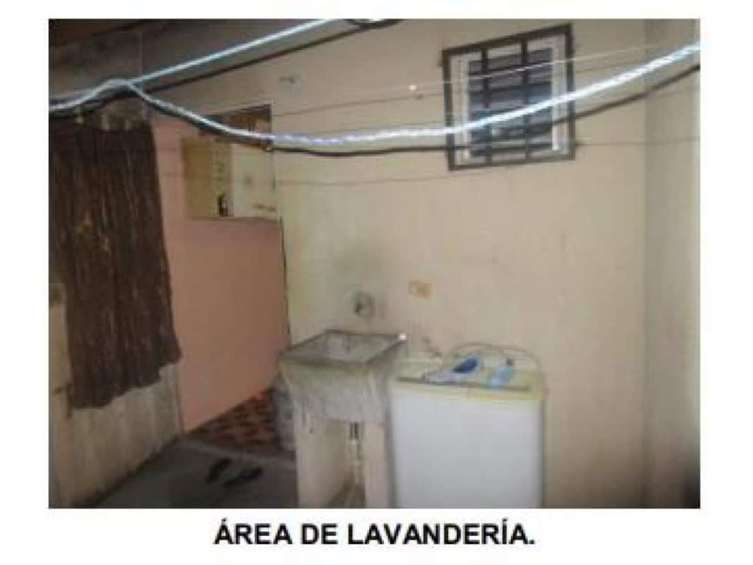 Laundry zone with utility sink washer and window with bars Pacora Panama