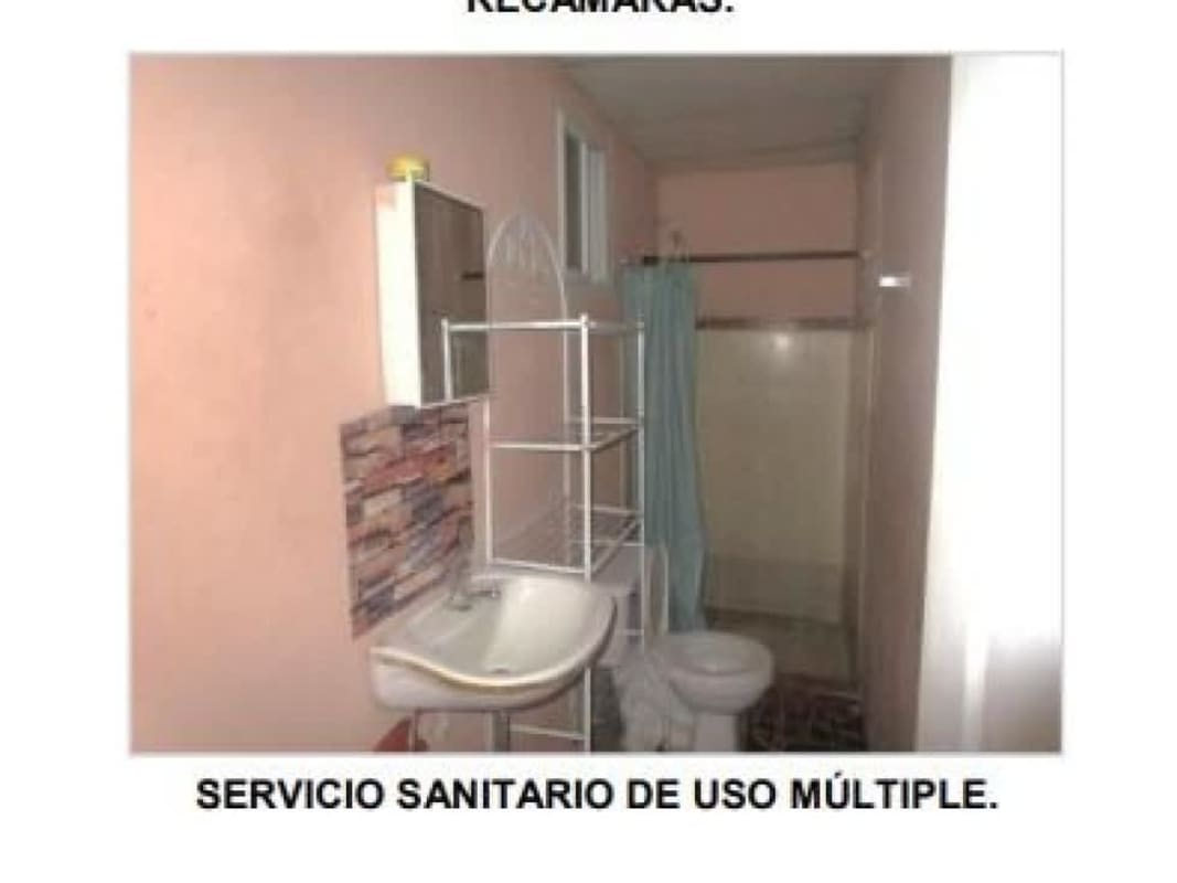 Side angle of one story house front view with porch security bars Pacora Panama