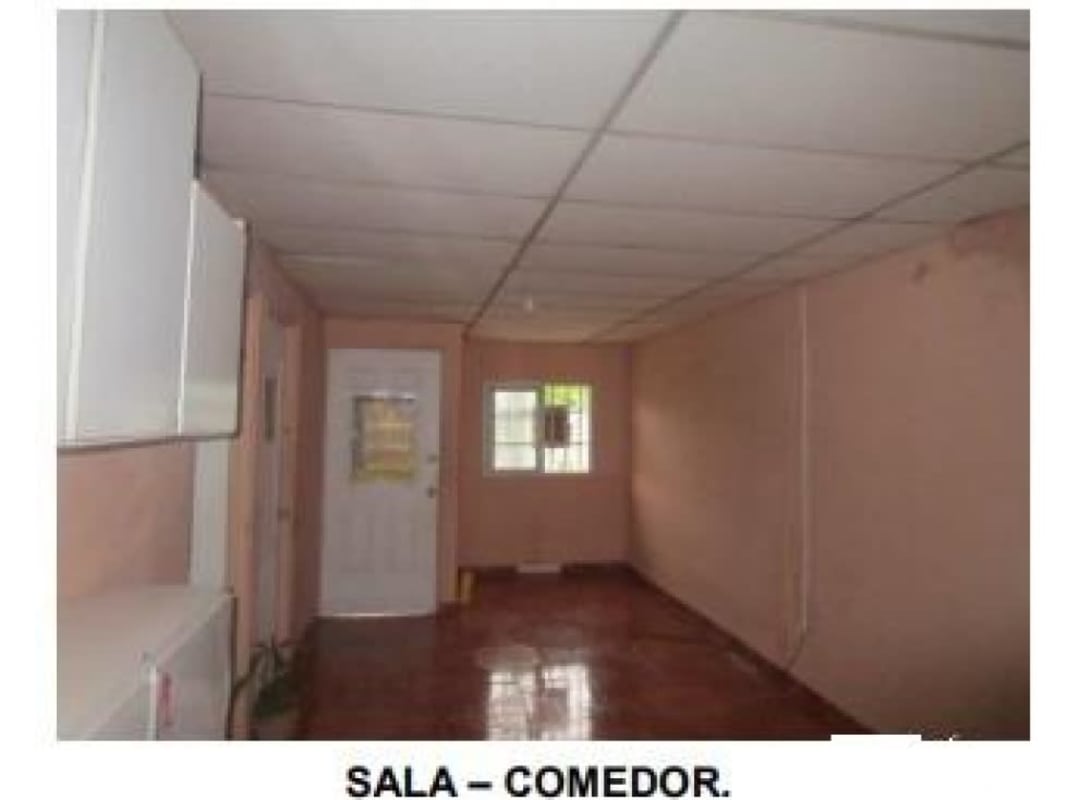 Simple living dining room with tiled floor peach walls Pacora Panama