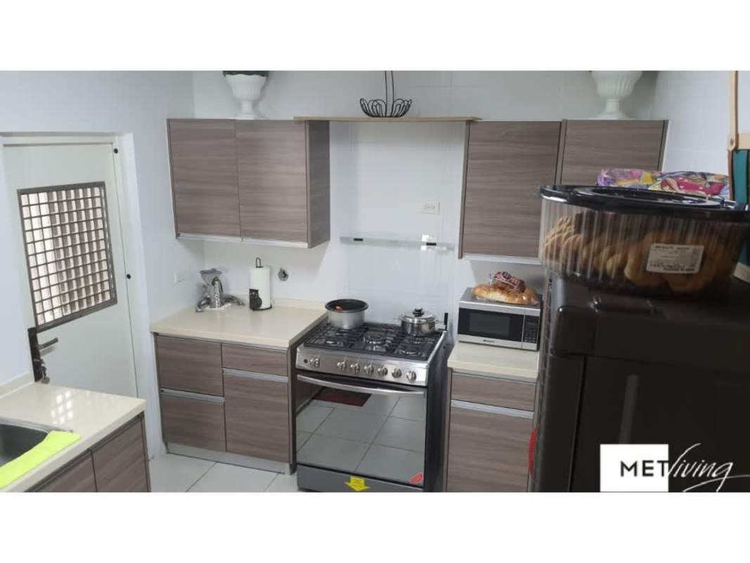 Modern kitchen with wood cabinets stainless appliances PH Victoria Panama