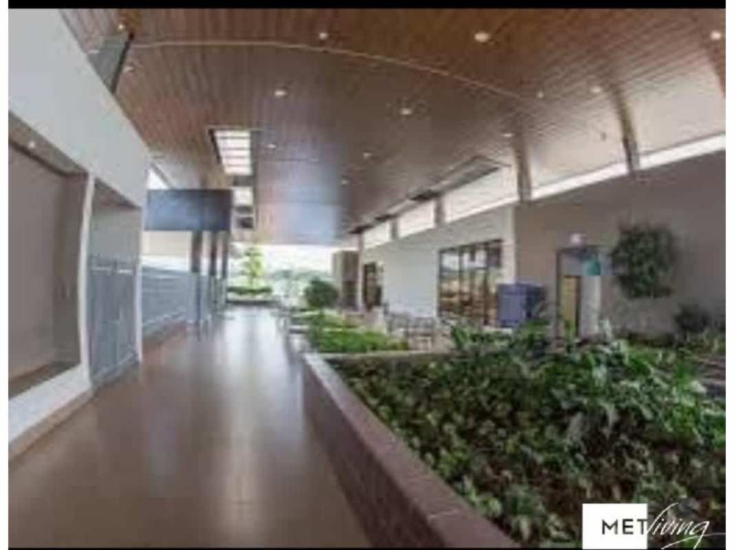 Bright indoor common area with skylights and plants PH Victoria Panama