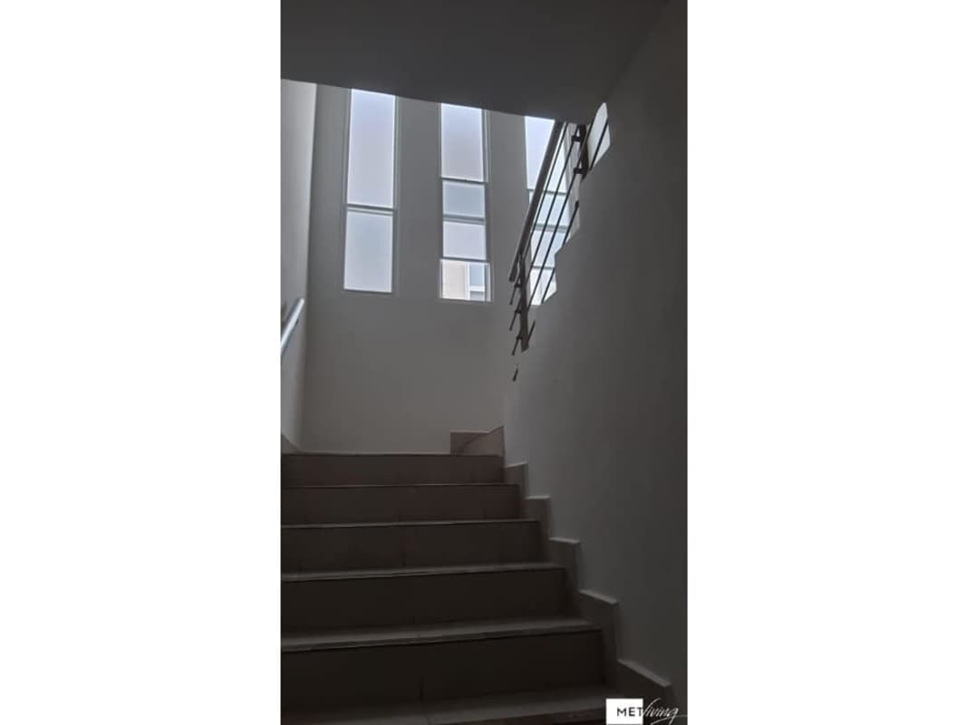 Staircase with large frosted glass windows PH Victoria Paseo del Norte Panama
