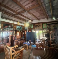 Stone pathway under mature trees in rustic garden Costa Esmeralda beach house San Carlos Panama