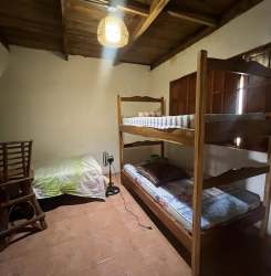 Bedroom with wood ceiling, tile floor, garden view Costa Esmeralda San Carlos Panama