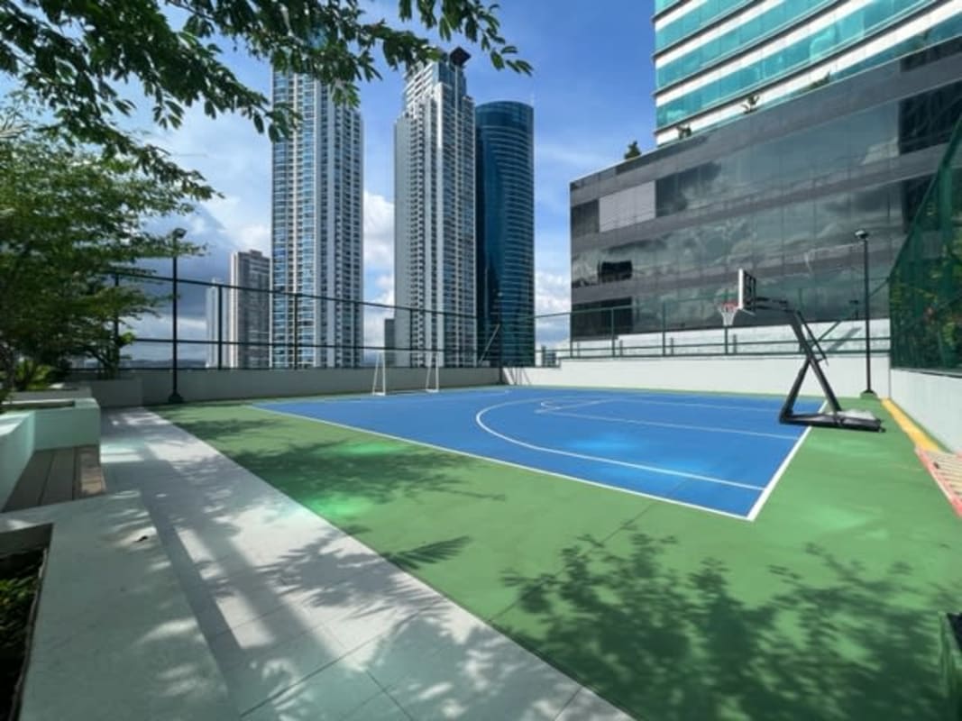 Rooftop basketball court with city skyline backrop at Upper East Tower Panama City