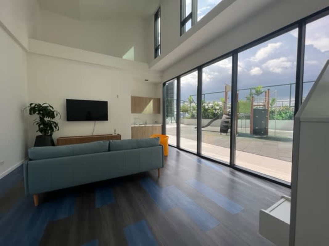 Spacious modern living room with high ceilings balcony views Upper East Tower Costa del Este Panama