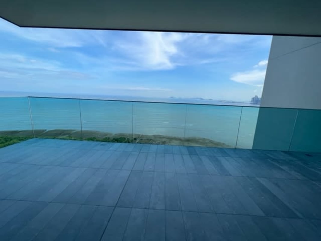 Modern outdoor infinity pool overlooking Pacific Ocean and skyline in Costa del Este Panama