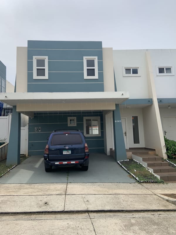 Gated community swimming pool with lounge chairs in PH Alpes Brisas del Golf Panama City