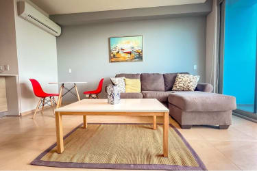 Open plan living dining with balcony access and ocean vistas at Royal Palm Playa Gorgona Panama