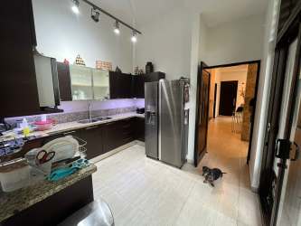 Kitchen with granite countertops stainless appliances wooden cabinets PH Nativa Panama Pacifico house