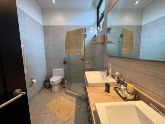 Outdoor covered patio with seating area garden view house Panama Pacifico