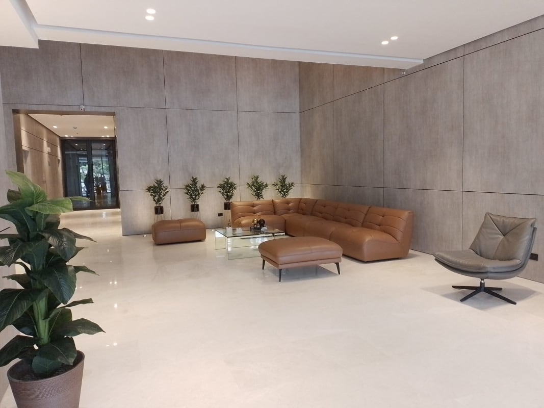 Bright living room with sliding doors to balcony in CenterPoint Tower 12 de Octubre Panama City