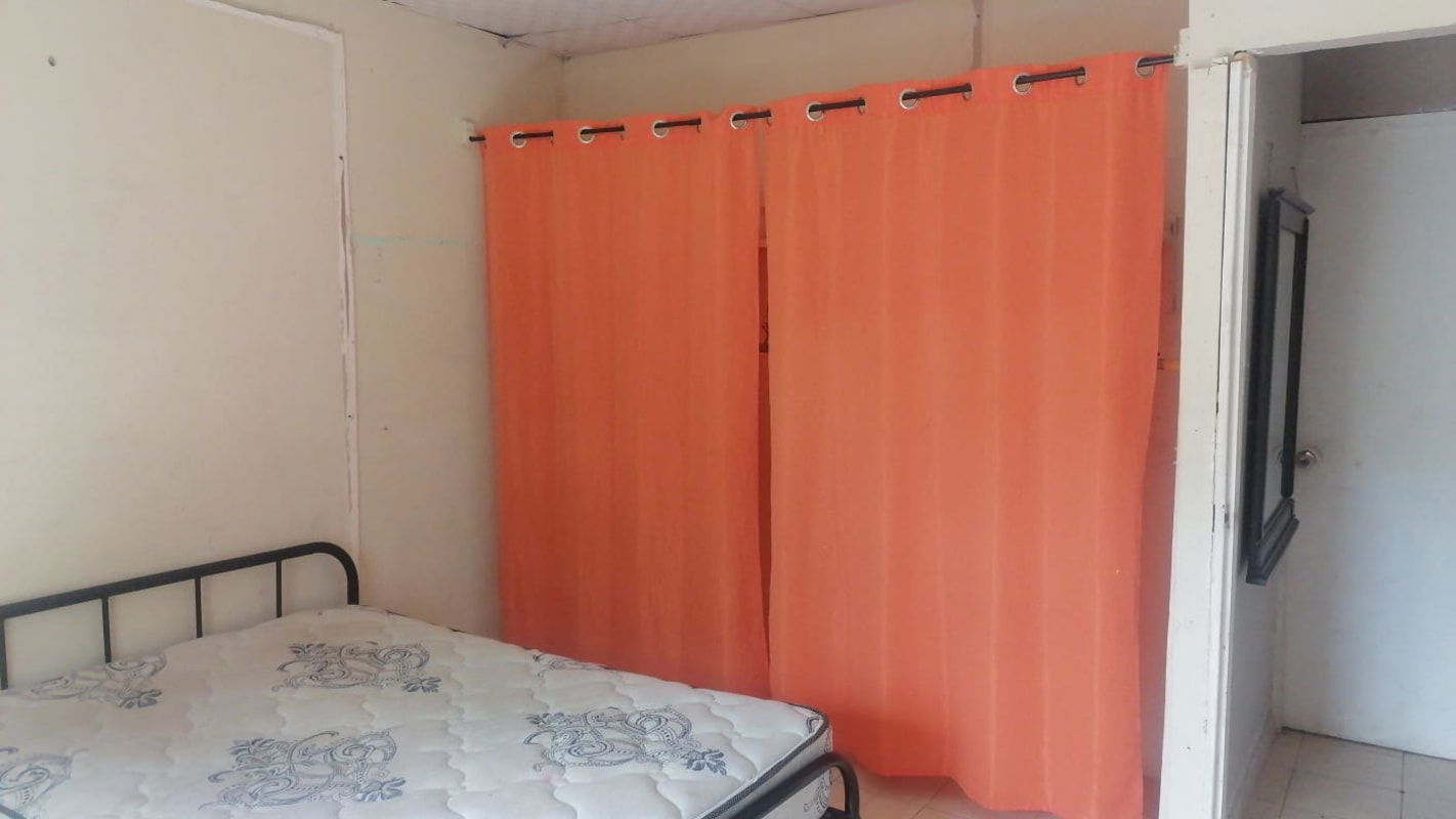 Interior of large warehouse with metal roof concrete floor in Concepción District Panama City