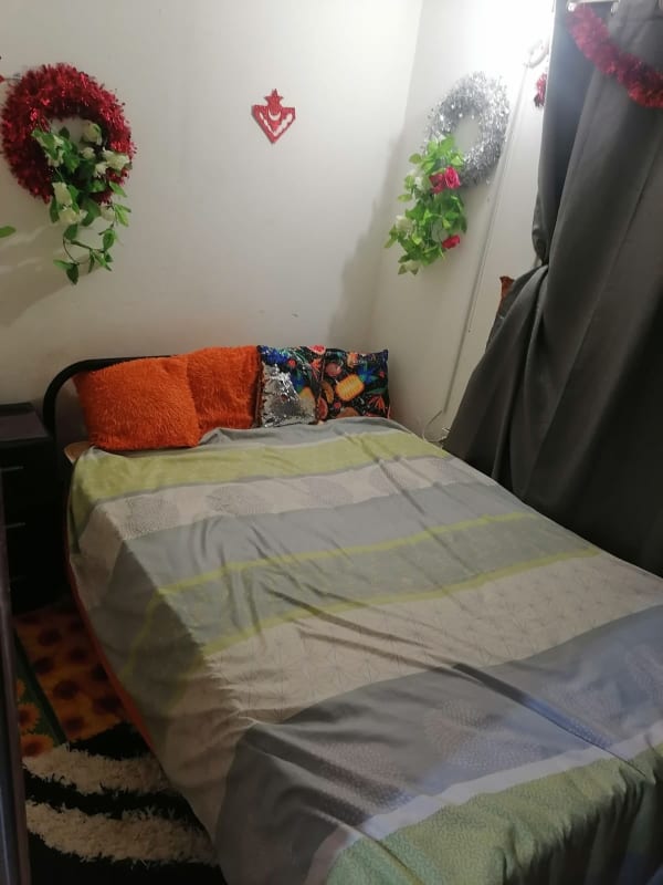 Basic bathroom with shower toilet sink tile floor in Ciudad Radial compound Panama