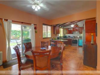 Fully equipped kitchen with wood cabinetry, granite countertops at Playa Blanca villa Panama