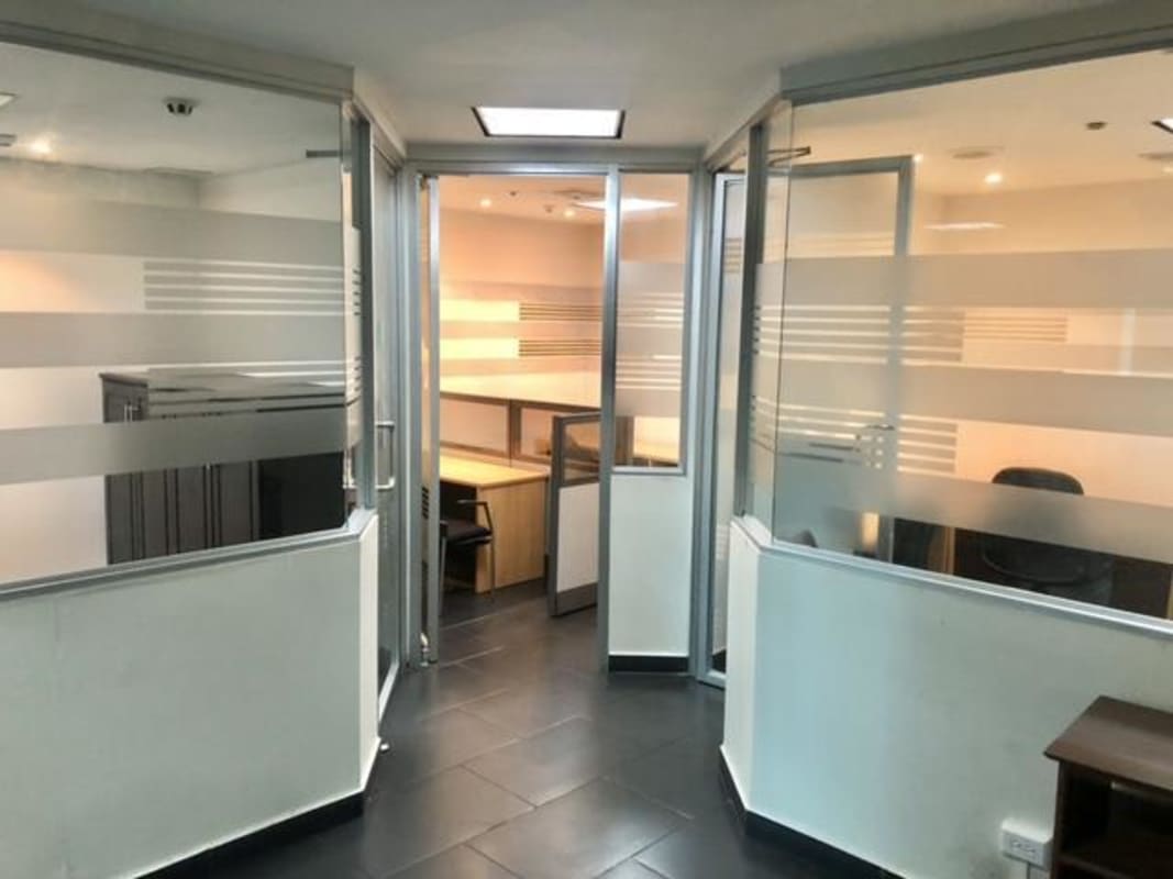 Private cubicles with frosted glass dividers in Ocean Business Plaza Marbella commercial office building
