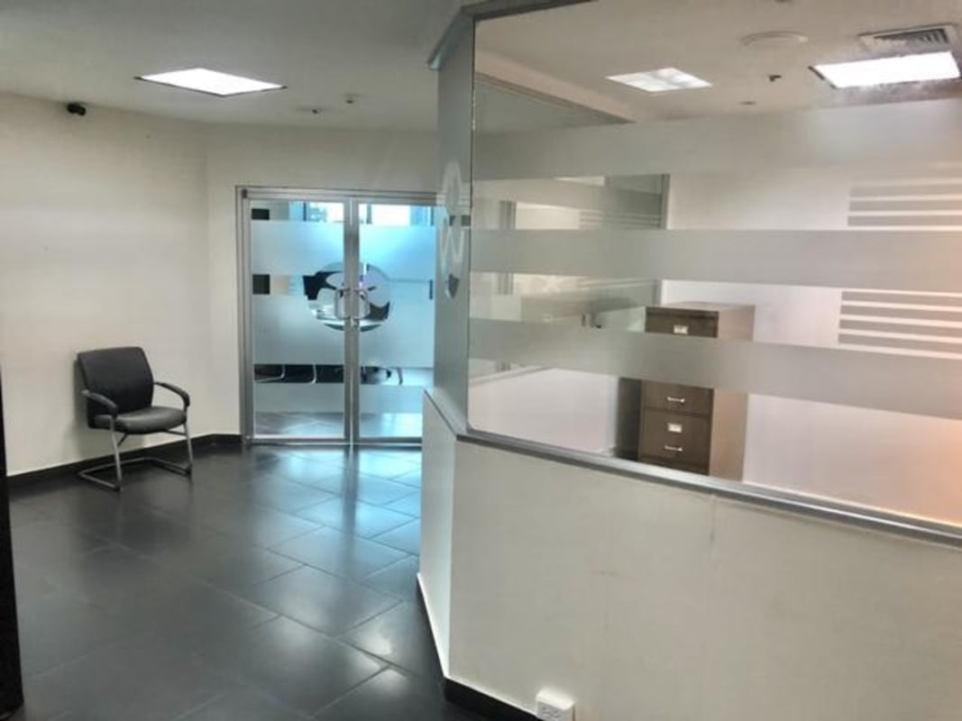 Glass partitioned office reception with frosted design inside Ocean Business Plaza Marbella Panama