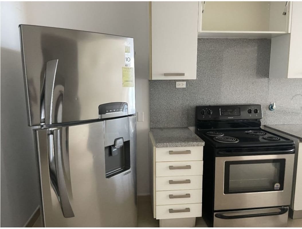 Master bedroom with walk-in closet, ocean view window, and split AC in PH White Tower Panama City