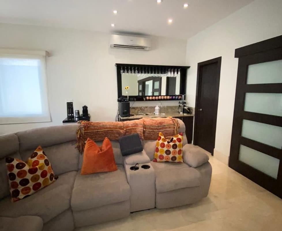 Front exterior of single-family house with landscaped garden and cement pathway Panama City