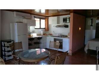 Traditional granite countertop kitchen wood cabinets large windows Altos del María Panama