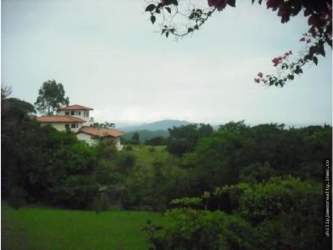 Mediterranean style home terracotta roof mountain backdrop Altos del María Panama