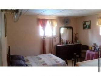 Spacious bedroom with French doors, wood ceiling and balcony at Altos del María Panama