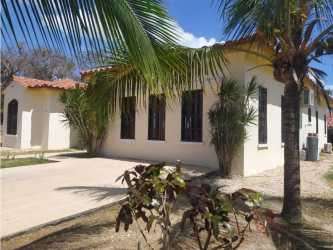 Bedroom with large windows and garden view in spacious estate Hacienda Pacifica San Carlos Panama