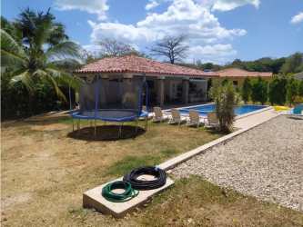 Large covered terrace with barbecue grill and ample seating area in San Carlos Panama home for sale