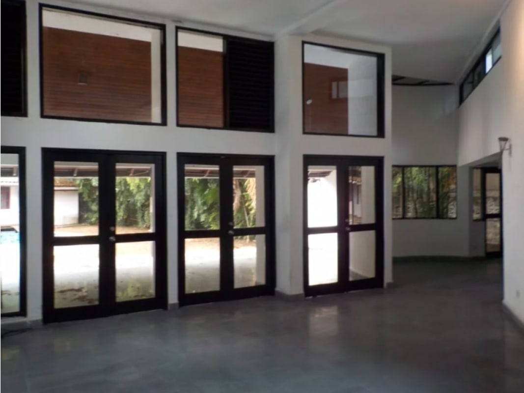 Modern kitchen with granite counters, wood cabinetry and bright natural light in Coco del Mar Panama