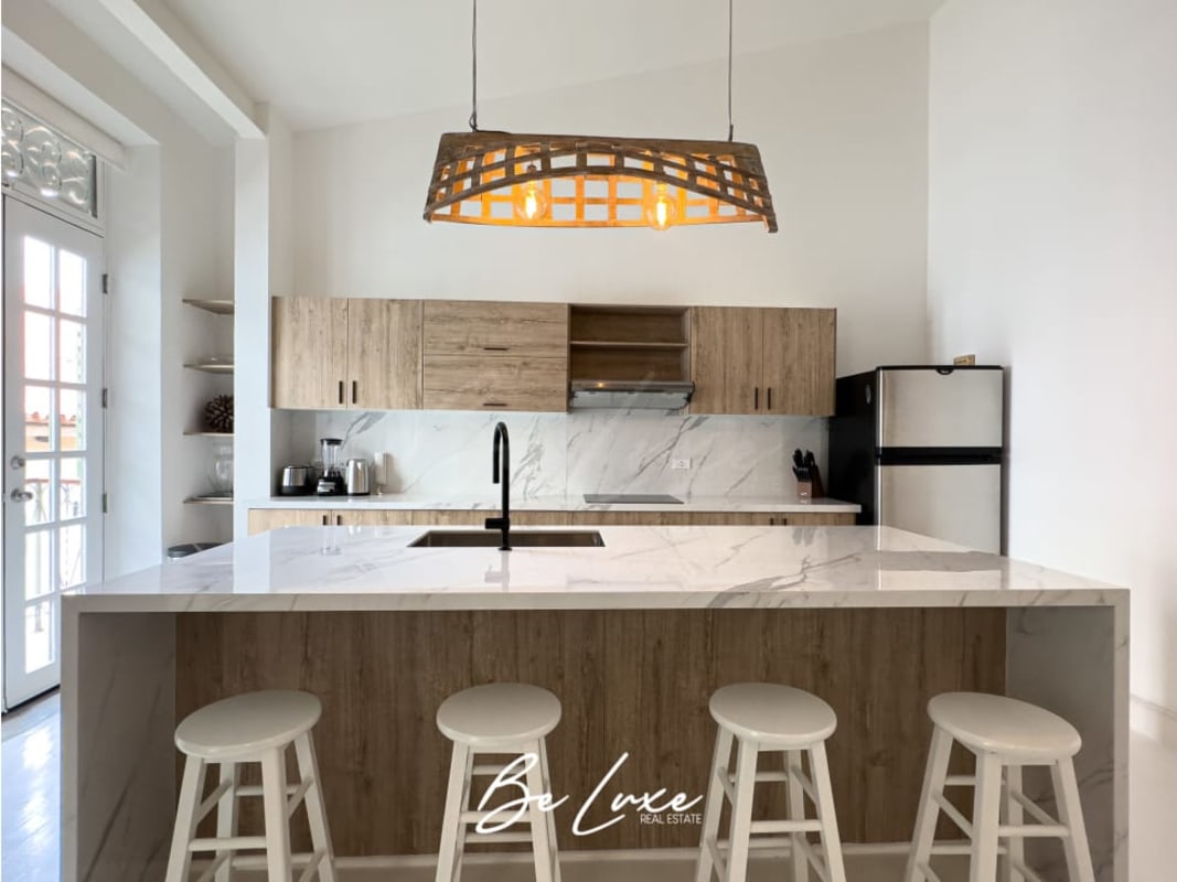 Contemporary bathroom with marble tile, vessel sink in colonial apartment Casco Viejo Panama