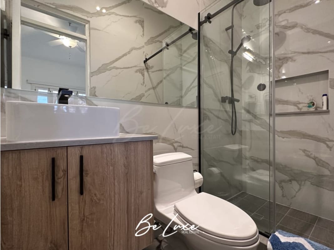 Spacious bedroom with hardwood floor, ceiling fan, ensuite bathroom PH Callejón de Chicheme Casco Viejo Panama