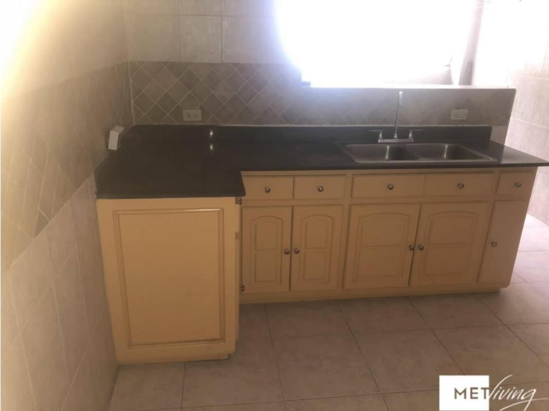 Traditional kitchen with granite countertop and sink in Villa Las Fuentes PH Betania Panama