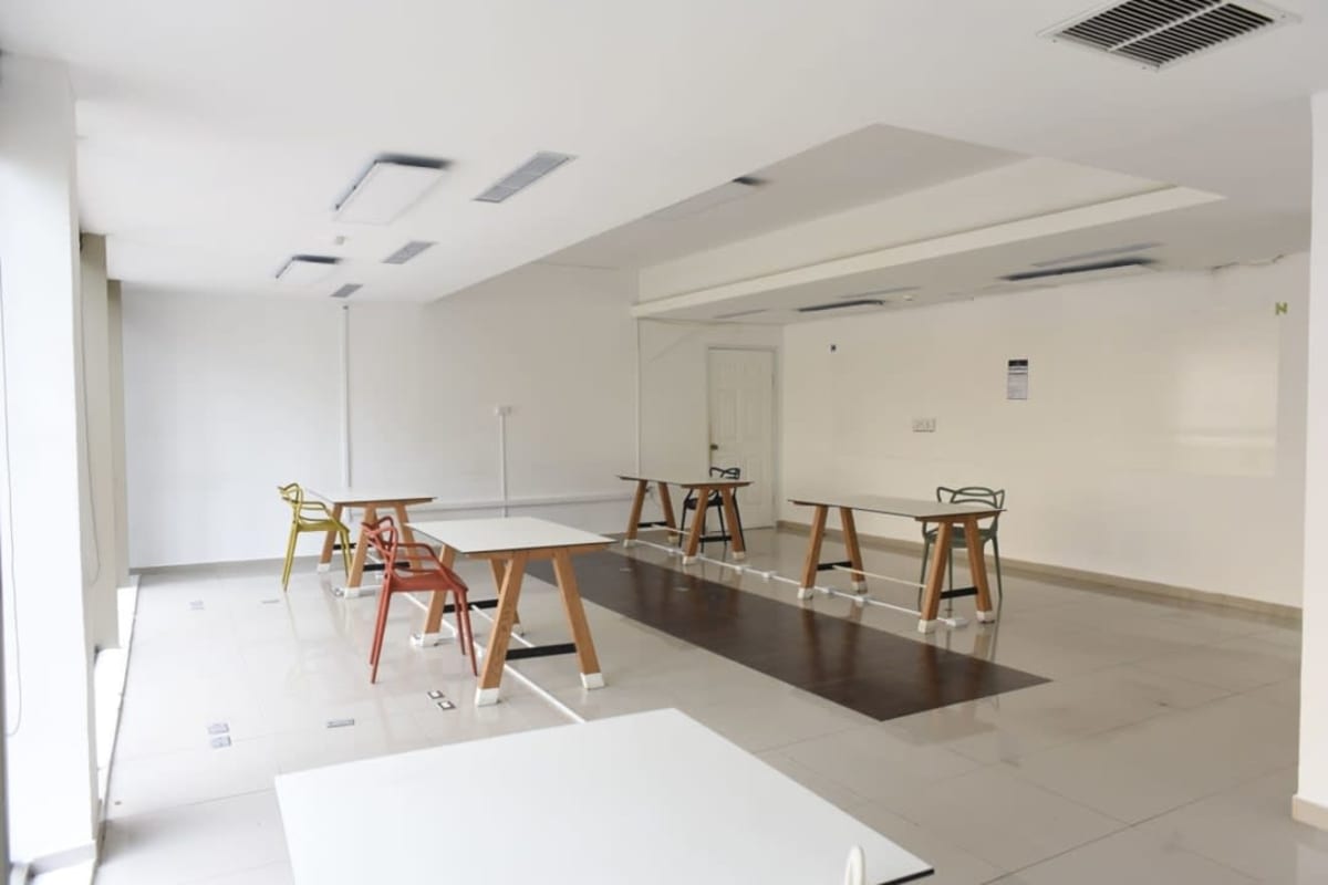 Contemporary bright open-plan office with desks and chairs in banking district Panama City