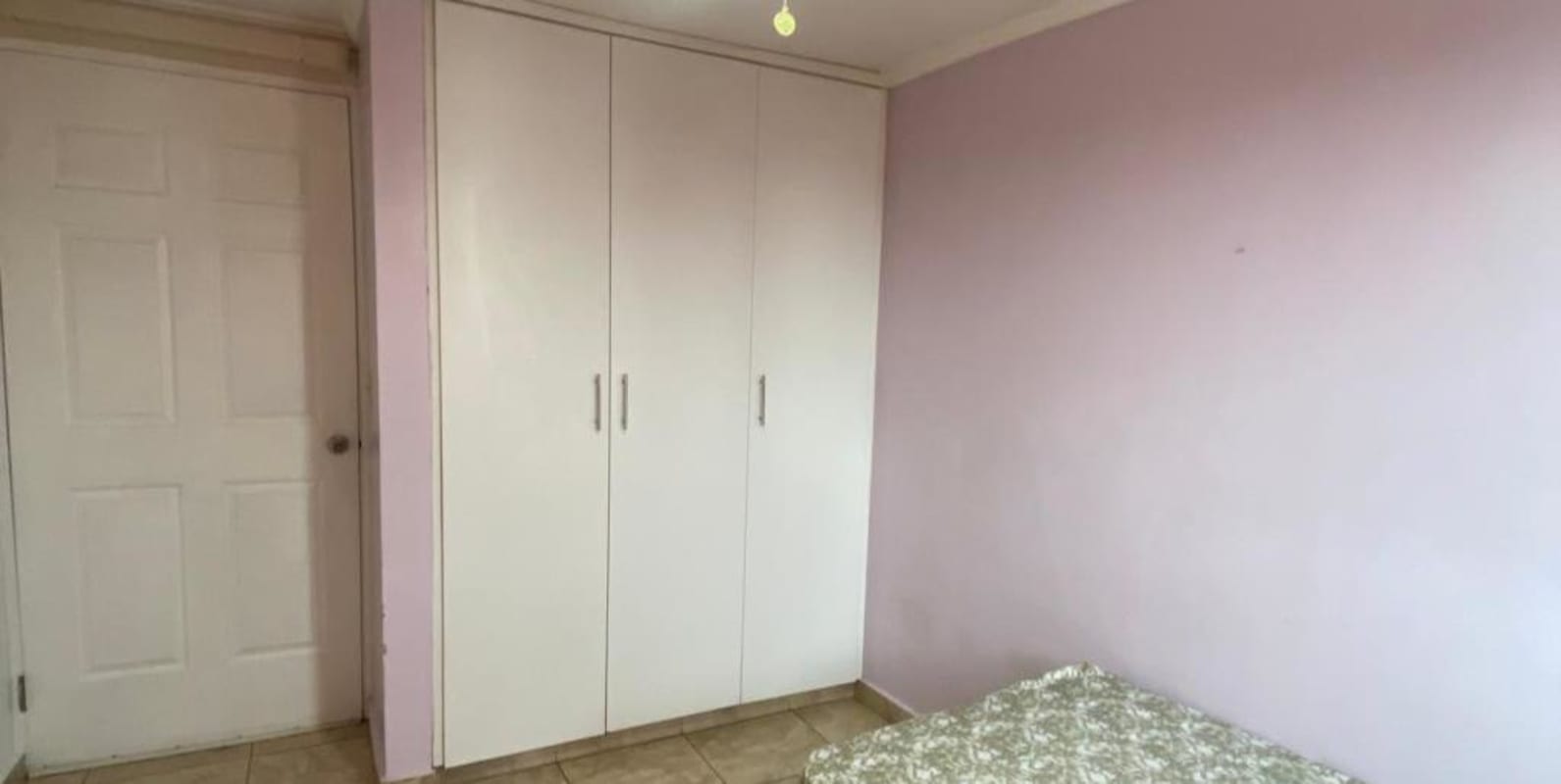 Bedroom with air conditioning, ceiling fan, built-in closet and natural light in PH Girasol PL