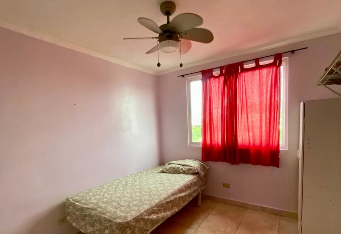 Bedroom featuring purple wall, window with curtain, ceiling fan, single bed PH Girasol PL