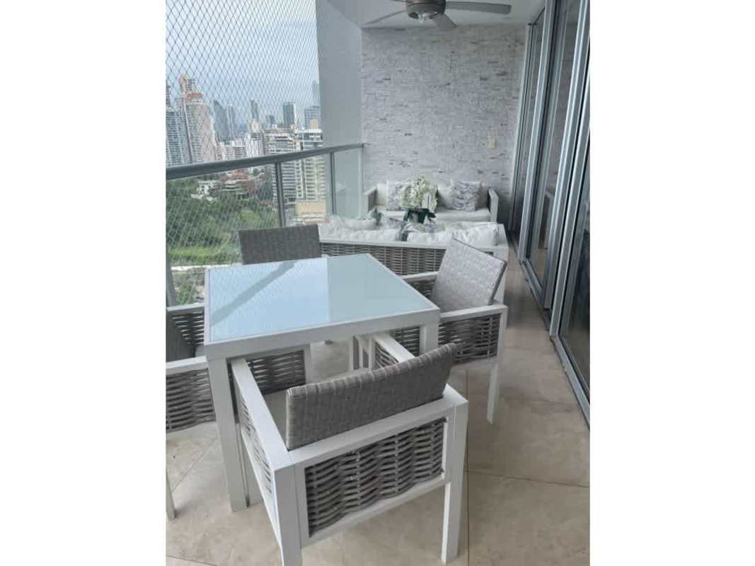 Balcony with skyline view, stylish outdoor furniture and protective netting at Q Tower Punta Pacifica Panama
