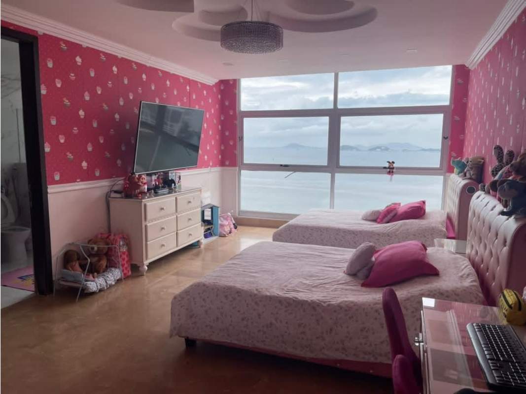 Pink themed kids room with sea view windows in PH Q Tower Punta Pacifica Panama