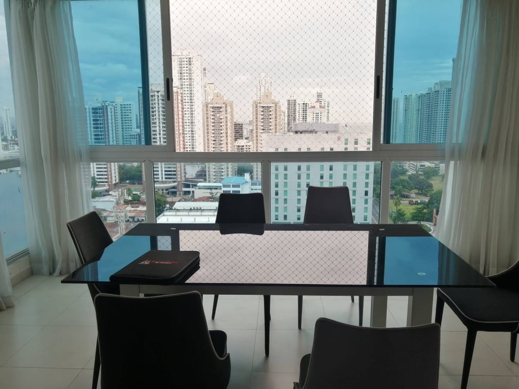 Open plan living and dining with balcony access panoramic city views PH Marina Plaza Panama