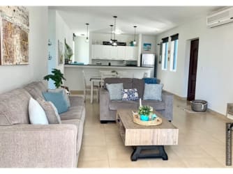 Spacious master bedroom with large window, ocean view, AC unit PH Terrazas de Farallón Playa Blanca Panama