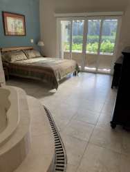 Modern bathroom with bathtub and double vanity in luxury golf villa Tucan Panama