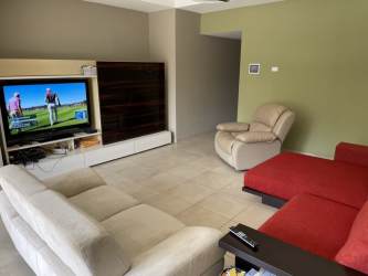 Spacious living room double height elegant design in golf villa Tucan Country Club Panama
