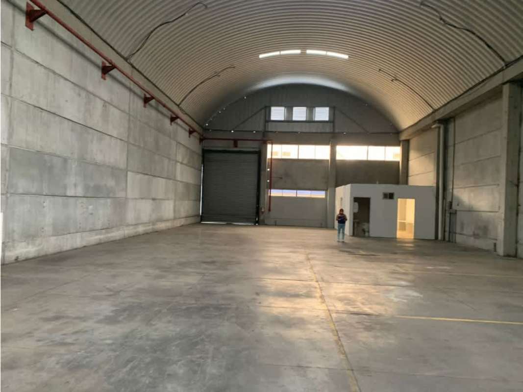 Warehouse interior with high vaulted metal ceiling, concrete floors in Panama City Villa Zaita industrial park
