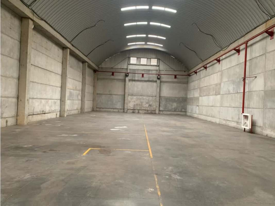 Industrial warehouse with natural light skylights, arched roof and concrete walls in Panama Villa Zaita