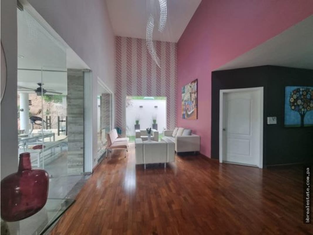 Spacious double-height living room in PH Fuentes del Fresno with glass doors to terrace in Altos de Panama