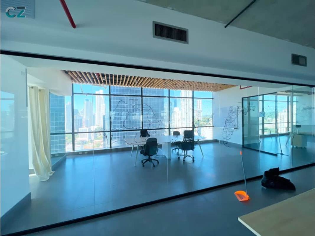 Large open-plan workspace with industrial ceiling exposed pipes Talima Venture Tower Calle 50 Panama
