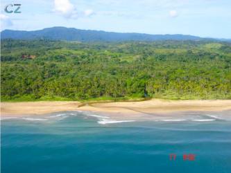 Lush tropical coastline with sandy beaches ocean waves aerial Costa Arriba Colon Panama