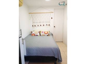 Small bedroom with air conditioning and closet in cabin container home Panama