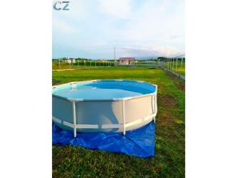 Glass table and floral decor on green yard with mountain surroundings in Panama