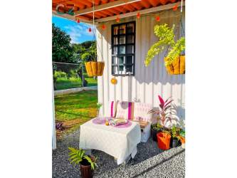 Colorful covered patio with plants and outdoor seating in Llano Grande Antón Panama